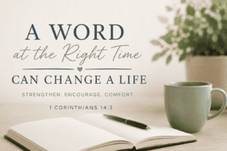 A Word at the Right Time Can Change a Life - 1 Corinthians 14:3 A muted text based image of a bible open on a table top along with a coffee cup and a green potted plant.